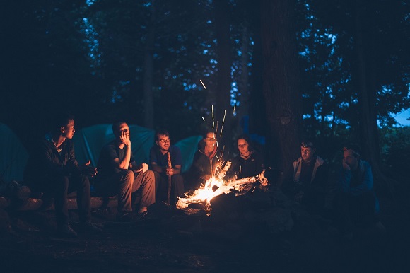 Group of people around a campfire