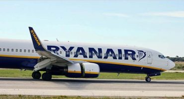 Ryanair cuts its airport check-in fee