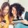 Two girls looking at a phone